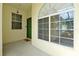 Inviting entryway featuring a large window and green door creating a warm and welcoming entrance at 168 Club Villas Ln, Kissimmee, FL 34744