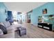 Bright and open living room with a modern design, hardwood floors, and access to the kitchen at 168 Club Villas Ln, Kissimmee, FL 34744