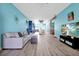 Bright and open living room with a modern design, hardwood floors, and access to the kitchen at 168 Club Villas Ln, Kissimmee, FL 34744