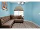 Cozy living area with hardwood floors, a comfortable couch, and natural light creating a relaxing atmosphere at 168 Club Villas Ln, Kissimmee, FL 34744