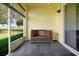 Cozy patio with slate flooring and a beautiful outdoor view of the green lawn at 168 Club Villas Ln, Kissimmee, FL 34744