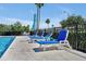 Relaxing poolside setting with comfortable lounge chairs and umbrellas for enjoying sunny days at 168 Club Villas Ln, Kissimmee, FL 34744