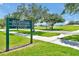 Remington Recreation Center sign with grassy green surroundings and beautiful walking paths at 168 Club Villas Ln, Kissimmee, FL 34744