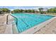 Sparkling community pool, inviting for swimming and relaxation, with a shallow end of 5 1/2 feet at 168 Club Villas Ln, Kissimmee, FL 34744