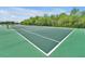 Well-maintained tennis court for active recreation in a beautiful outdoor setting at 168 Club Villas Ln, Kissimmee, FL 34744