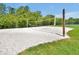 Sandy volleyball court surrounded by greenery, perfect for beach volleyball fun at 168 Club Villas Ln, Kissimmee, FL 34744