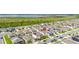 Aerial view of a neighborhood near a lake, highlighting residential properties and surroundings at 176 Sofia Ln, Lake Alfred, FL 33850