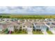 Community overview featuring well-maintained homes and community amenities near a lake and green space at 176 Sofia Ln, Lake Alfred, FL 33850