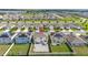 Elevated view of a home with a spacious backyard in a residential community with well-manicured lawns at 176 Sofia Ln, Lake Alfred, FL 33850