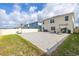 Spacious backyard with a paved patio, featuring a basketball hoop and providing ample space for outdoor enjoyment at 176 Sofia Ln, Lake Alfred, FL 33850