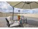 Relaxing patio setup with comfortable seating and shade umbrella, perfect for outdoor enjoyment at 176 Sofia Ln, Lake Alfred, FL 33850