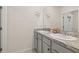 Bathroom featuring a dual sink vanity with grey cabinets and a granite countertop at 176 Sofia Ln, Lake Alfred, FL 33850