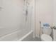 Bathroom showcasing a shower and bathtub combination with tiled walls at 176 Sofia Ln, Lake Alfred, FL 33850