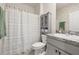 Cozy bathroom with a shower/tub combo, stylish vanity, and neutral decor at 176 Sofia Ln, Lake Alfred, FL 33850