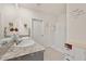 Bright bathroom featuring double sinks, granite countertop, and a walk-in shower providing a clean and modern space at 176 Sofia Ln, Lake Alfred, FL 33850