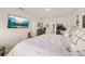 Comfortable bedroom featuring a spacious bed, TV, and dresser, offering a relaxing and well-appointed space at 176 Sofia Ln, Lake Alfred, FL 33850