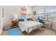 Bedroom featuring natural light, a work desk, and a colorful bed, making it perfect for relaxation and study at 176 Sofia Ln, Lake Alfred, FL 33850