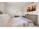 Bright bedroom features a television, dresser, and neutral walls, creating a calm and relaxing space at 176 Sofia Ln, Lake Alfred, FL 33850