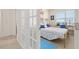 Sunlit bedroom featuring a desk, a bed, and a calming color scheme at 176 Sofia Ln, Lake Alfred, FL 33850