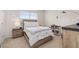 Cozy bedroom with a comfortable bed, a nightstand, and a bookshelf, perfect for reading and relaxing at 176 Sofia Ln, Lake Alfred, FL 33850
