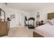 Bedroom featuring a dark wooden bed, dresser, and a open closet providing ample storage at 176 Sofia Ln, Lake Alfred, FL 33850