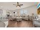 Inviting living area featuring comfortable seating and seamless flow to the dining area at 176 Sofia Ln, Lake Alfred, FL 33850