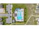 Aerial view of a community pool with lounge chairs and covered seating at 176 Sofia Ln, Lake Alfred, FL 33850