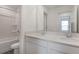 Bathroom featuring double sinks and quartz countertops at 208 Flag Lilly Ln, Umatilla, FL 32784