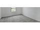 Bedroom featuring neutral carpet, a bright window, and pond view at 208 Flag Lilly Ln, Umatilla, FL 32784