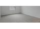 Neutral bedroom with carpet floors and a bright window at 208 Flag Lilly Ln, Umatilla, FL 32784