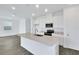 Bright kitchen featuring white cabinetry, stainless steel appliances, and a center island at 212 Flag Lilly Ln, Umatilla, FL 32784