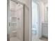 Shower room with installed shower and view to toilet room at 216 Flag Lilly Ln, Umatilla, FL 32784