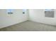 Bedroom with plush carpeting and natural light from three windows at 216 Flag Lilly Ln, Umatilla, FL 32784