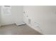 Laundry room featuring tile flooring, window, and hookups at 216 Flag Lilly Ln, Umatilla, FL 32784