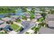 Aerial view of a home in a residential area near a pond with mature landscaping at 2255 Stone Lake Ct, Orlando, FL 32824