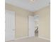 Bedroom with two doors, neutral paint color, and carpet flooring at 2255 Stone Lake Ct, Orlando, FL 32824