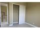 Carpeted bedroom showcasing a closet with sliding doors and a large window at 2255 Stone Lake Ct, Orlando, FL 32824
