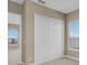 Bedroom with carpet floors, neutral paint color, closet and window at 2255 Stone Lake Ct, Orlando, FL 32824