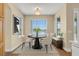 Charming breakfast nook with a round table, seating for four, and a view of the lake at 2255 Stone Lake Ct, Orlando, FL 32824
