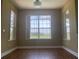 Light-filled dining area with laminate floors, multiple windows, and a serene view at 2255 Stone Lake Ct, Orlando, FL 32824