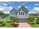 Charming two-story home with a well-maintained lawn and beautiful landscaping in a waterfront community at 2255 Stone Lake Ct, Orlando, FL 32824