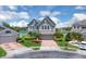 Aerial view of a two-story home with brick driveway, mature landscaping, and large front windows at 2255 Stone Lake Ct, Orlando, FL 32824