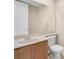 A half bathroom features a mirrored wall, single sink vanity and white toilet at 2255 Stone Lake Ct, Orlando, FL 32824