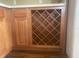 The kitchen has a built-in wooden wine rack next to the refrigerator at 2255 Stone Lake Ct, Orlando, FL 32824