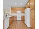 Classic kitchen with light wood cabinets and white appliances at 2255 Stone Lake Ct, Orlando, FL 32824