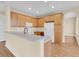 Updated kitchen with light wood cabinets and a breakfast bar at 2255 Stone Lake Ct, Orlando, FL 32824