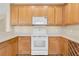 Bright kitchen features wooden cabinets, white appliances, and ample counter space at 2255 Stone Lake Ct, Orlando, FL 32824