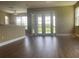 Sunny living room flows to outdoor patio; features laminate floors, neutral walls, and modern recessed lighting at 2255 Stone Lake Ct, Orlando, FL 32824