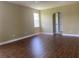 Bright, spacious living room featuring laminate floors and an archway that provides an open and airy feel at 2255 Stone Lake Ct, Orlando, FL 32824