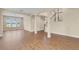 Spacious living area with hardwood floors, arched doorways, and a view of the backyard at 2255 Stone Lake Ct, Orlando, FL 32824